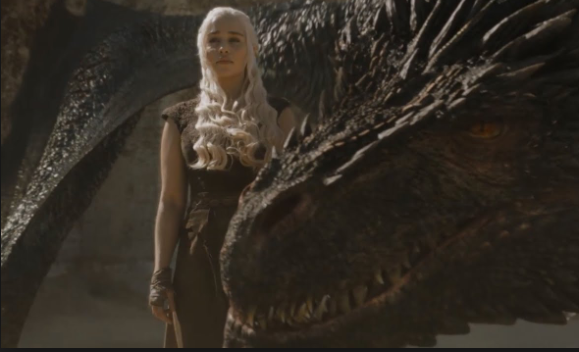 Daenerys standing beside one of her dragons